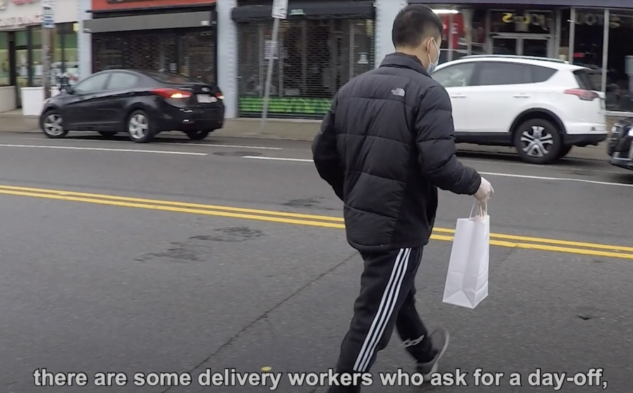 A+delivery+worker+delivers+food.