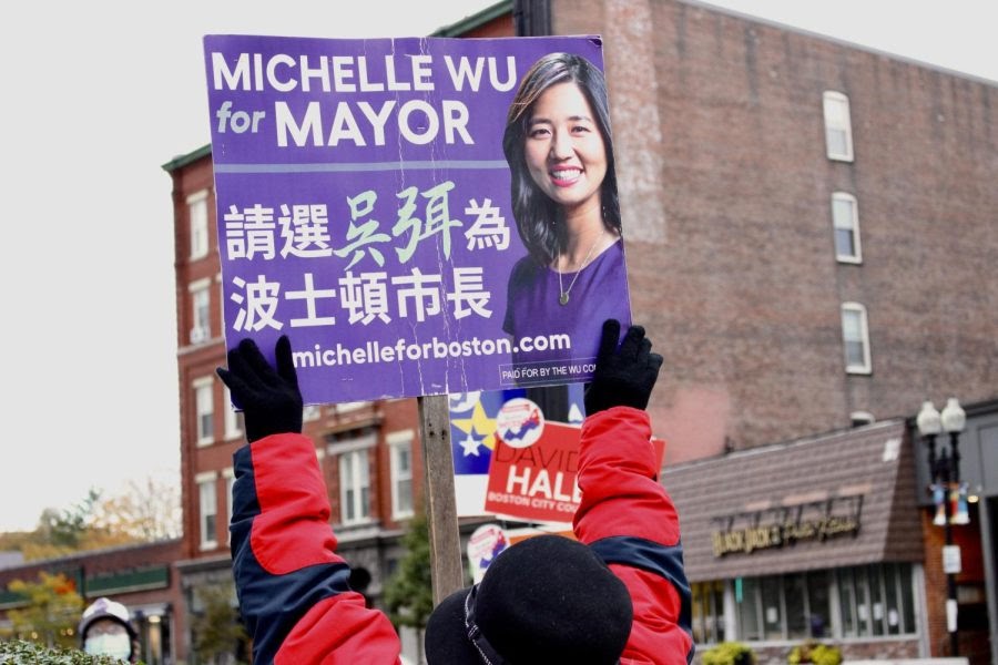 A Michelle Wu supporter holds up her campaign sign on election, Nov. 2, 2021.