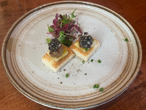 An appetizer at Nagomi Izakaya: Roasted toast with apple slices, grilled foie gras and caviar. 