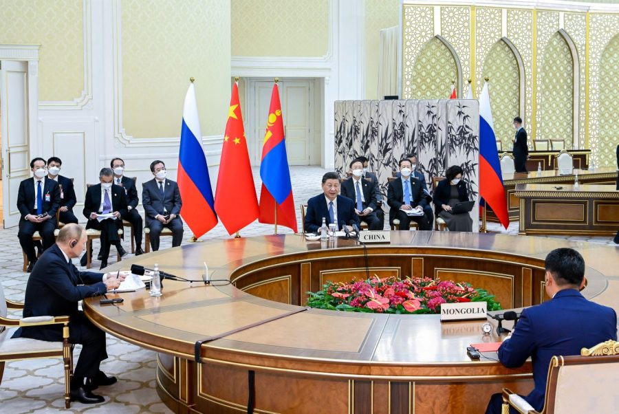 Xi meets with Russian President Vladimir Putin, left, and Mongolian President Ukhnaa Khurelsukh in Samarkand, Uzbekistan, in September 2022.